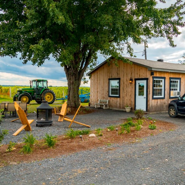Domaine Berthiaume - A wooden building in the countryside.