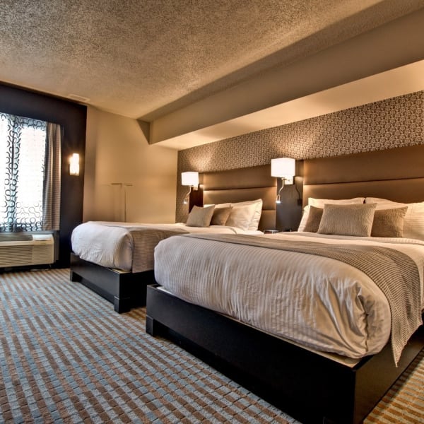 Chambre avec deux lits de l'Hôtel Nouvelle Frontière.
