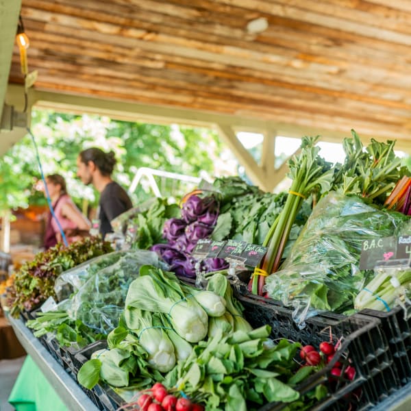 Compton evening market - A kiosk full of vegetables.